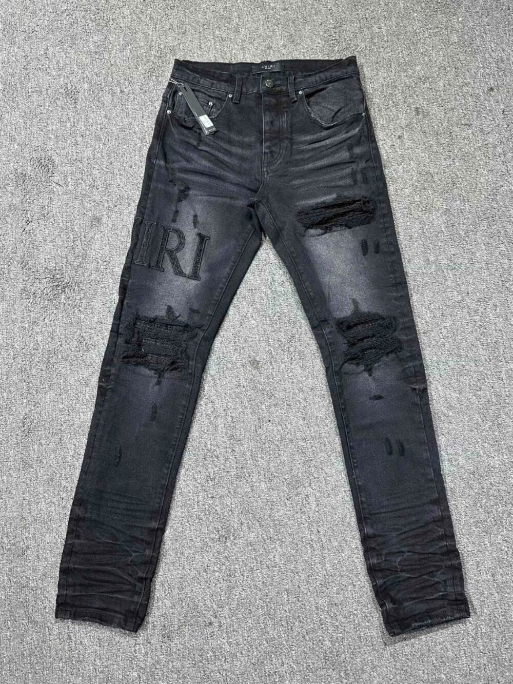 AMIRI Ripped Black Casual Jeans With Small Holes And Logo